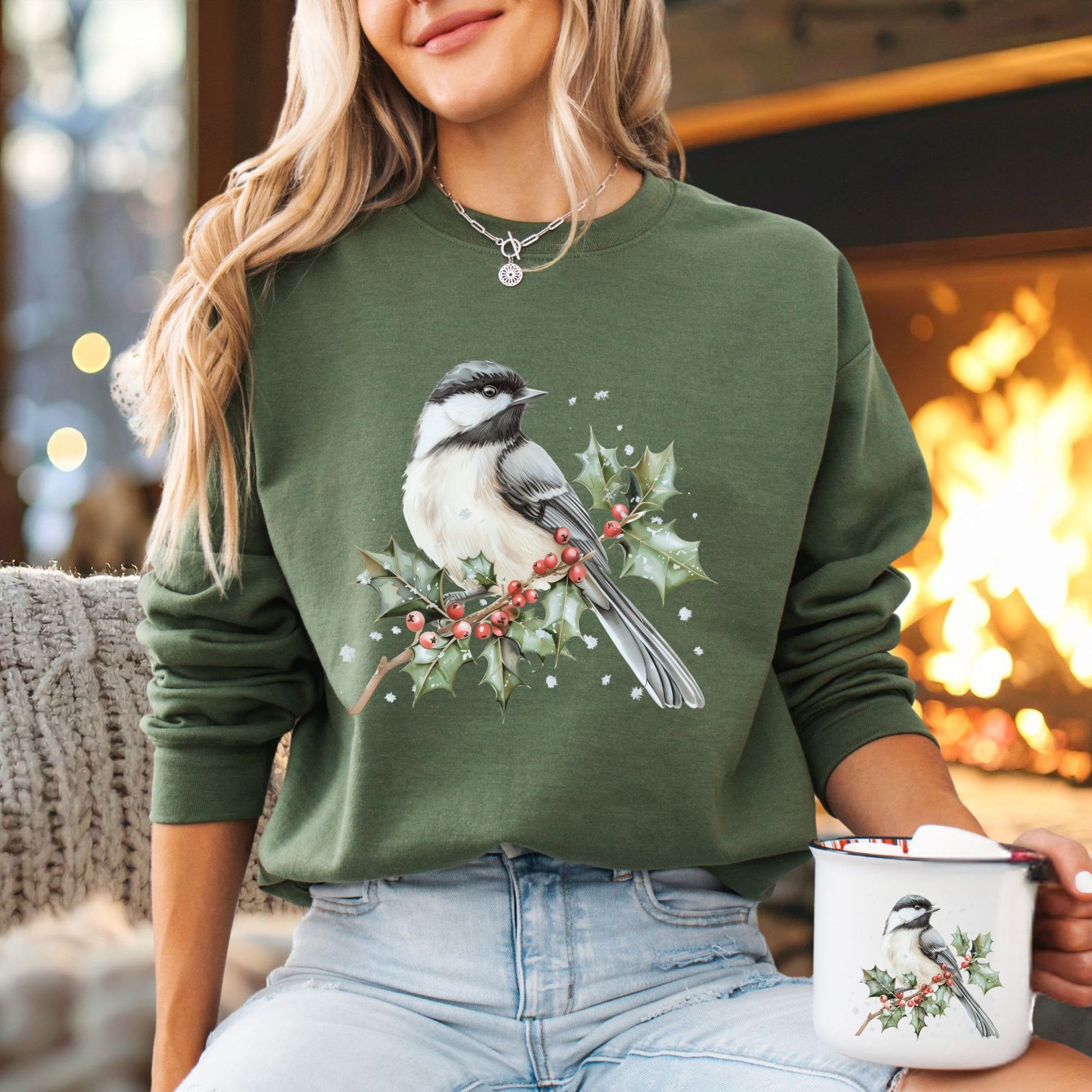 Green heavy blend sweatshirt with a watercolor chickadee on a frosted holly branch design.