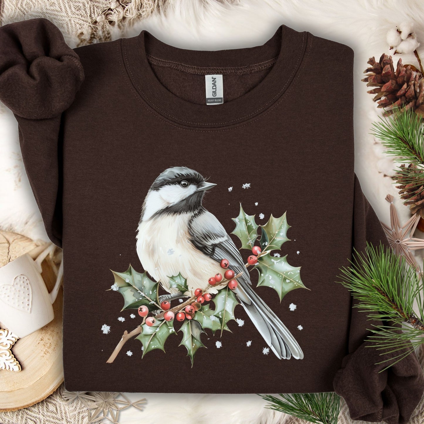 Dark chocolate crewneck sweatshirt with a watercolor chickadee on a frosted holly branch design.