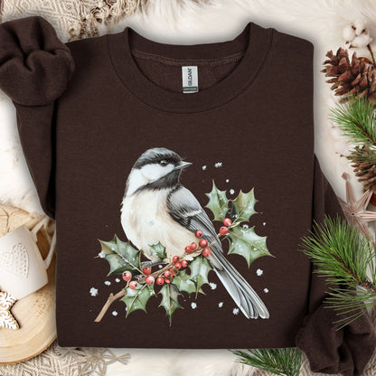 Dark chocolate crewneck sweatshirt with a watercolor chickadee on a frosted holly branch design.