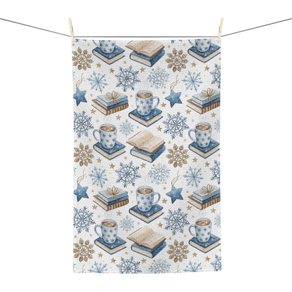 Winter Cup of Cocoa & Books microfiber kitchen towel with blue and neutral illustrations.