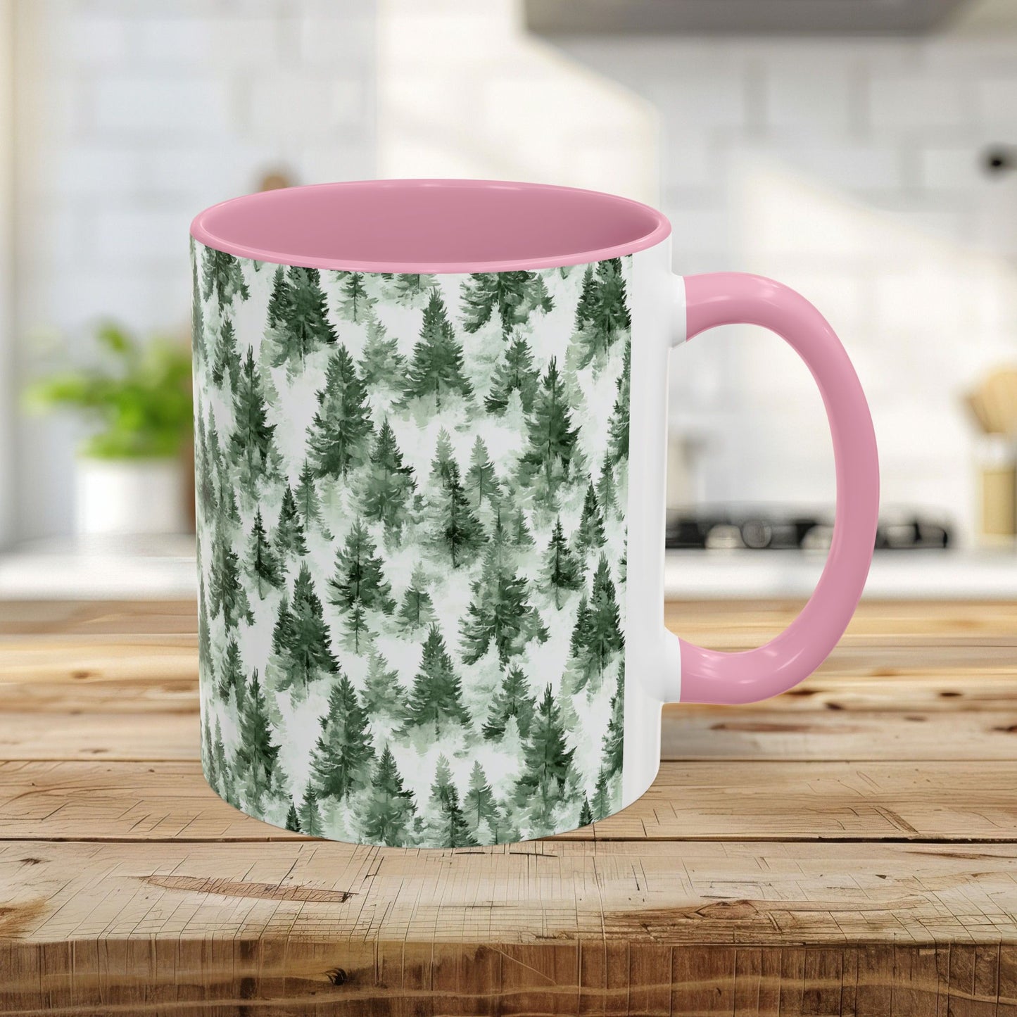 11oz ceramic mug with a pink handle and interior, featuring a watercolor evergreen forest pattern.
