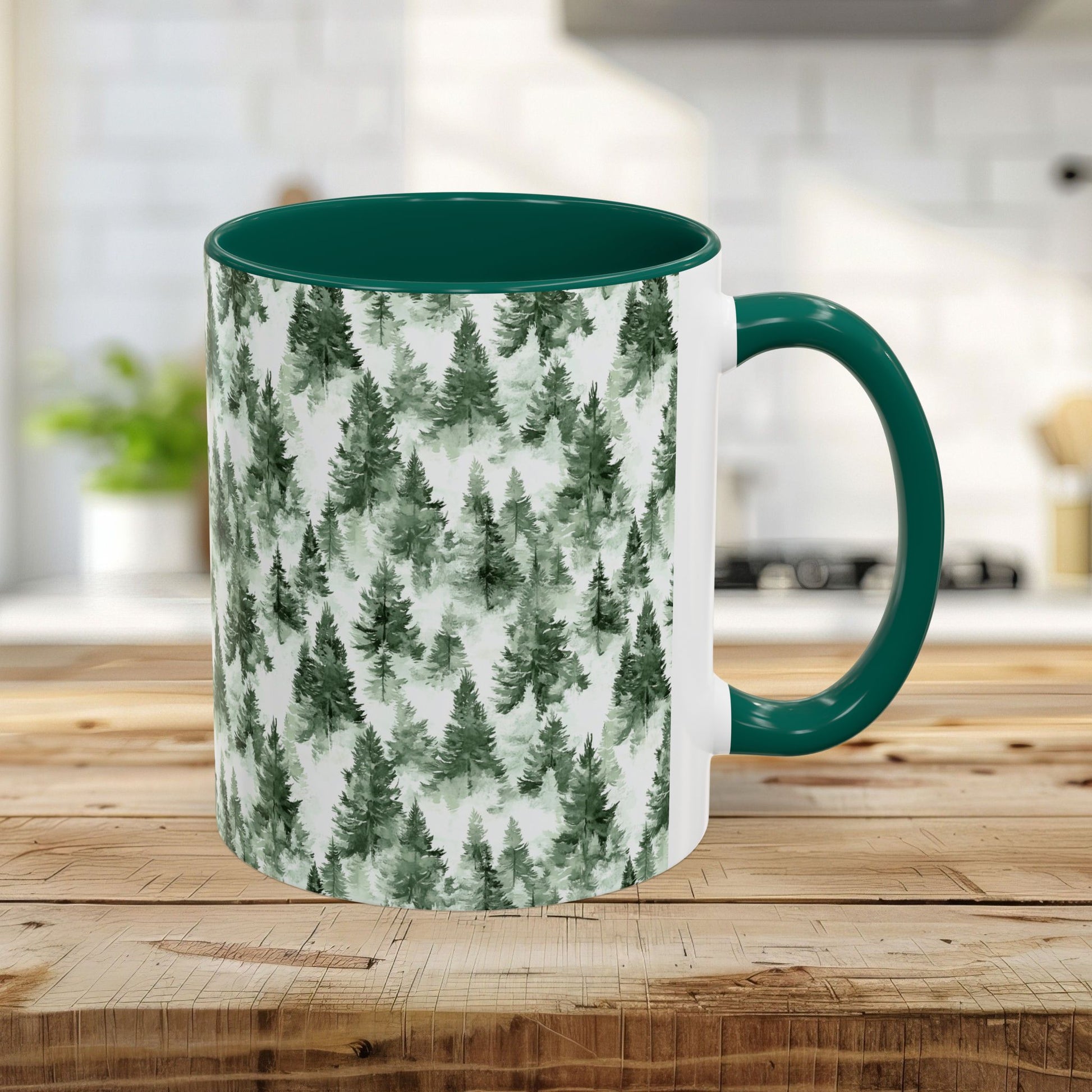 11oz ceramic mug with a green handle and interior, featuring a watercolor evergreen forest pattern.