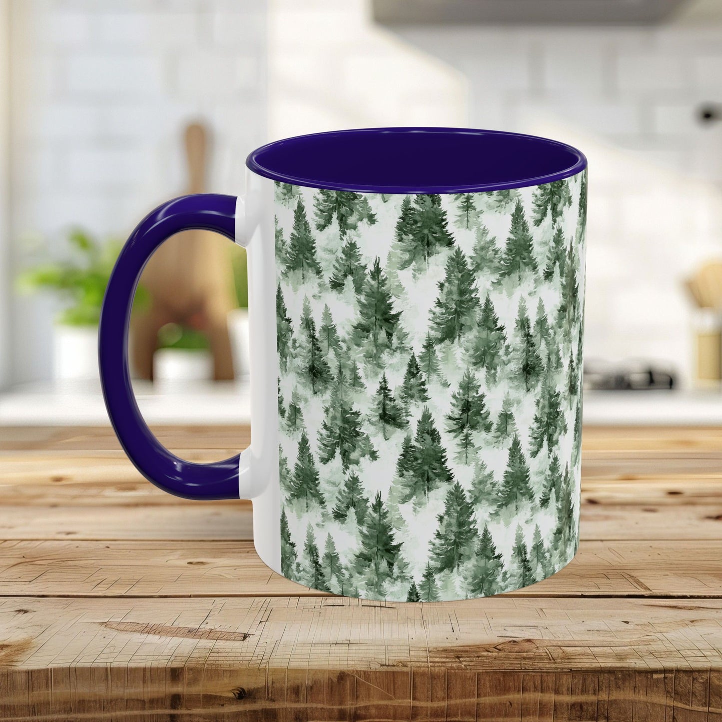 White ceramic mug with a watercolor evergreen forest design and a contrasting purple handle and interior.