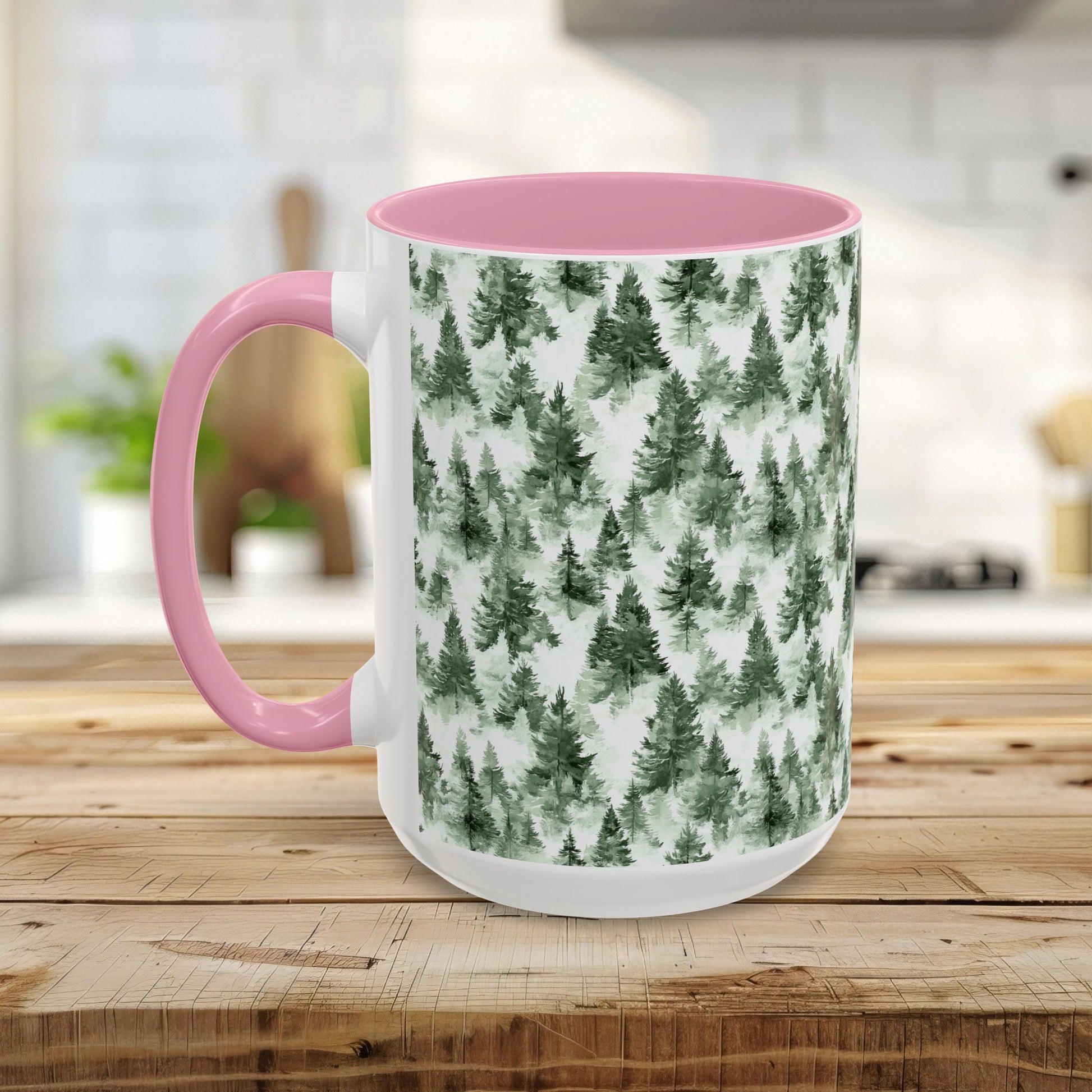 White ceramic mug with a pink handle and interior, featuring a watercolor evergreen forest pattern.