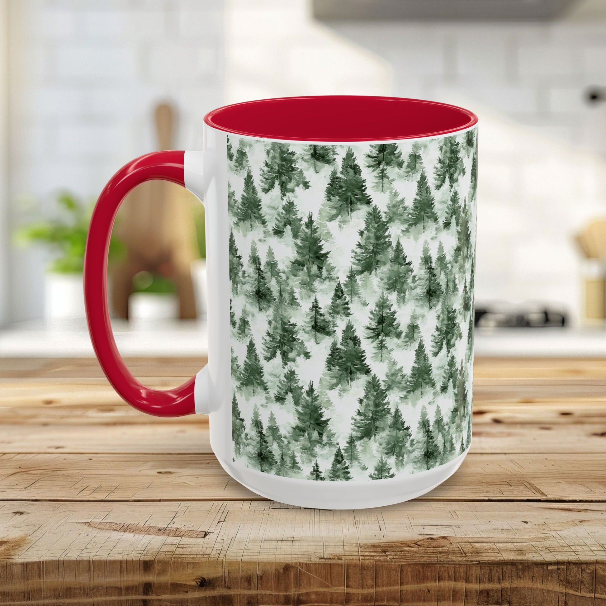 White ceramic 15oz mug with a red handle and interior, featuring a watercolor evergreen forest pattern.
