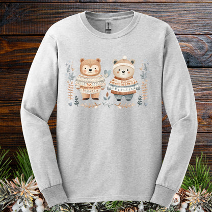 Ash long-sleeve tee with two watercolor bears in fair isle sweaters, winter foliage, hearts, and snowflakes.