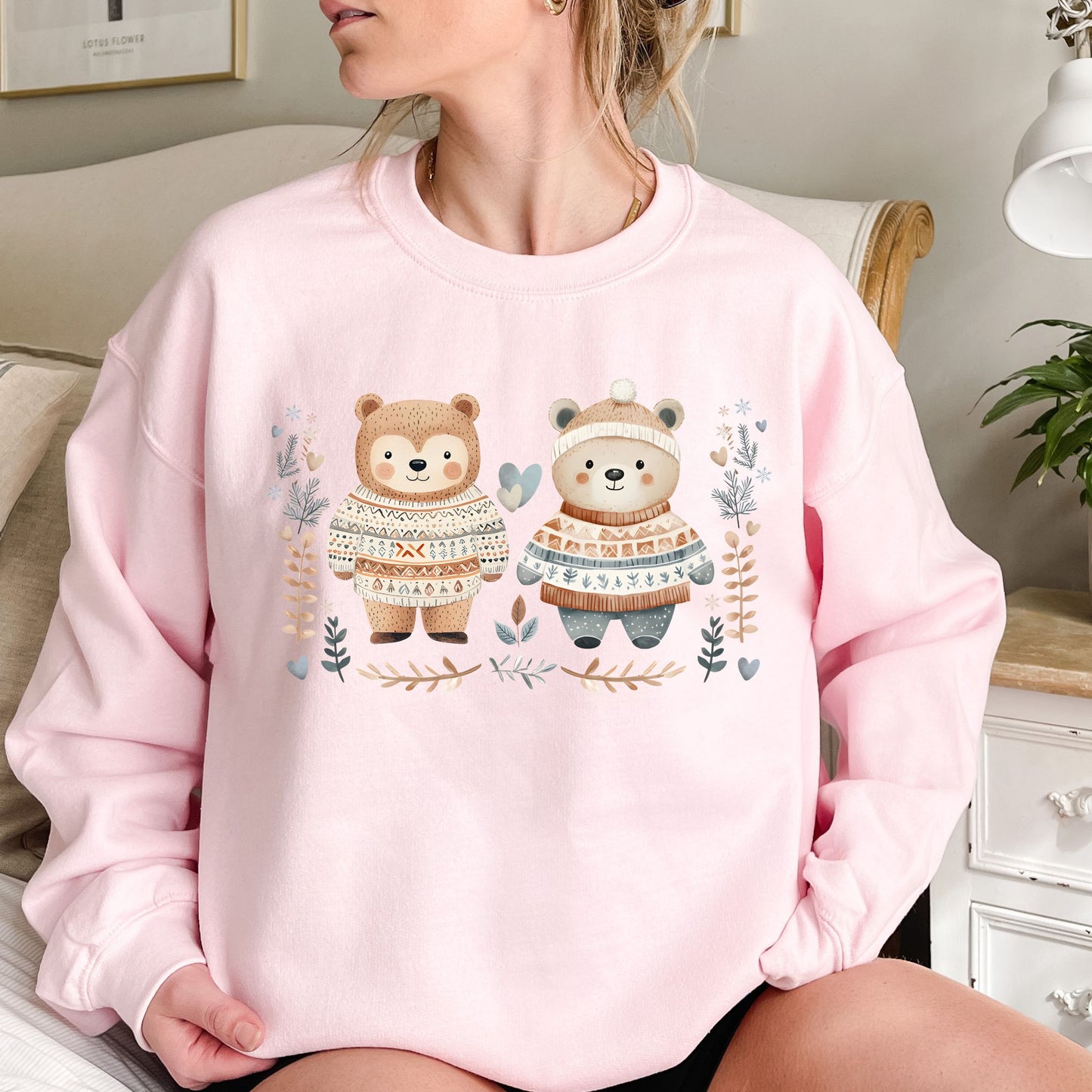 Pink heavy blend sweatshirt with two fair isle love bears, winter foliage, snowflakes, and hearts.