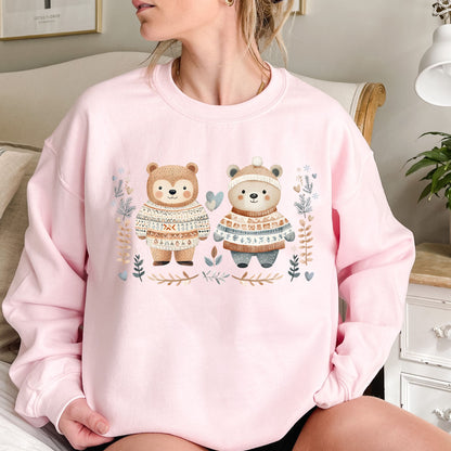 Pink heavy blend sweatshirt with two fair isle love bears, winter foliage, snowflakes, and hearts.