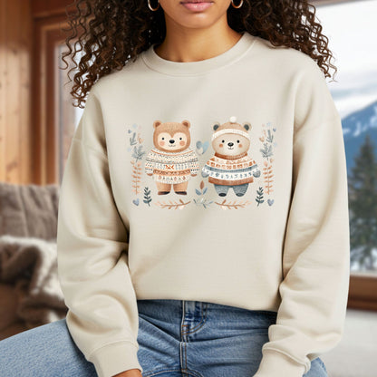 Beige heavy blend sweatshirt with two fair isle sweater-wearing love bears, winter foliage, snowflakes, and hearts.