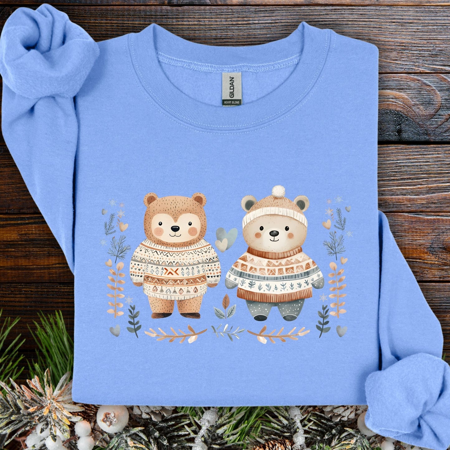 Carolina Blue S sweatshirt with two love bears in Fair Isle sweaters, winter foliage, snowflakes, and hearts.