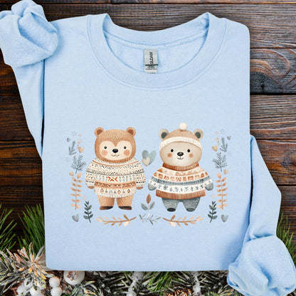 Light blue cotton-polyester sweatshirt with two fair isle love bears, winter foliage, snowflakes, and hearts.