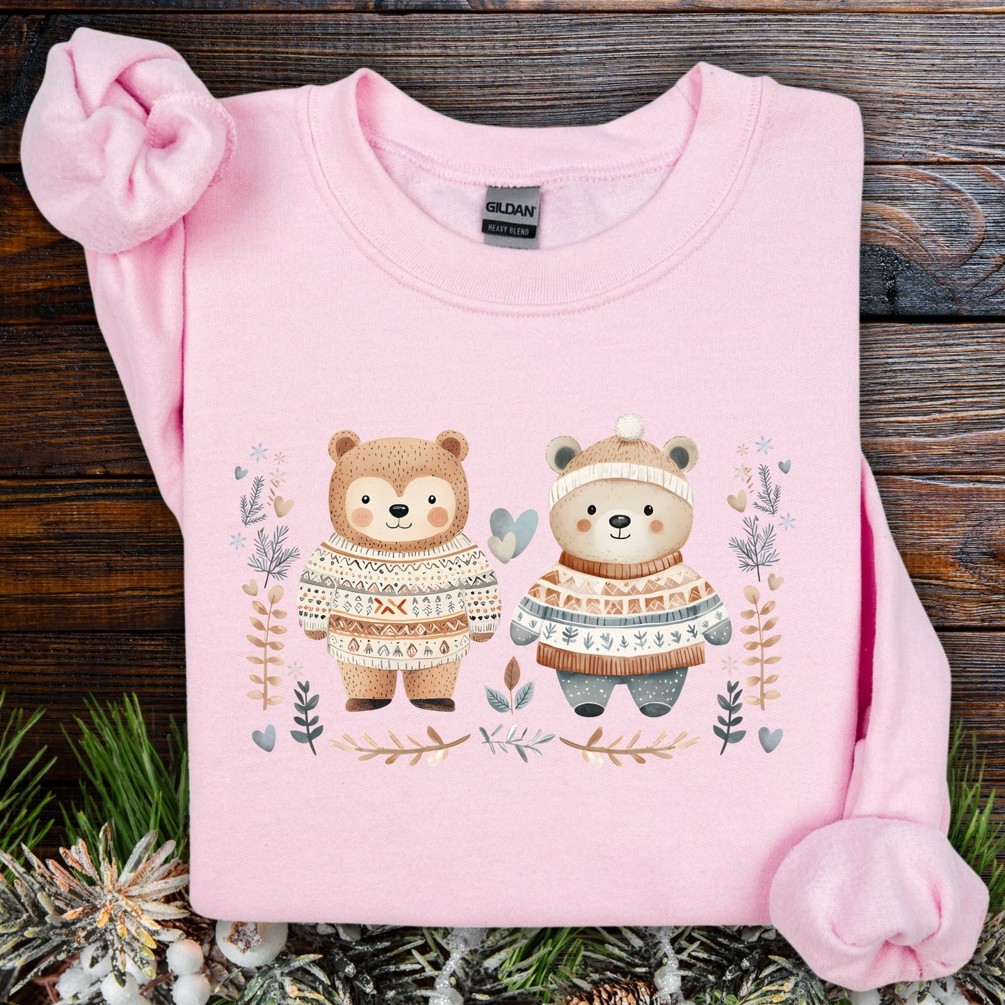Light pink Gildan sweatshirt with two cute bears in Fair Isle sweaters, winter foliage, snowflakes, and hearts.