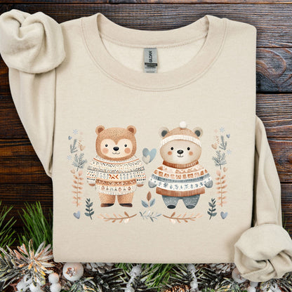 Sand S sweatshirt with two love bears in Fair Isle sweaters, winter foliage, snowflakes, and hearts.