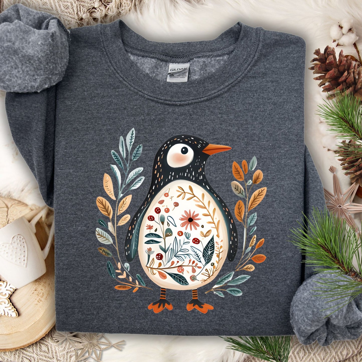 Dark Heather S sweatshirt with a whimsical folk art penguin adorned with botanical patterns.