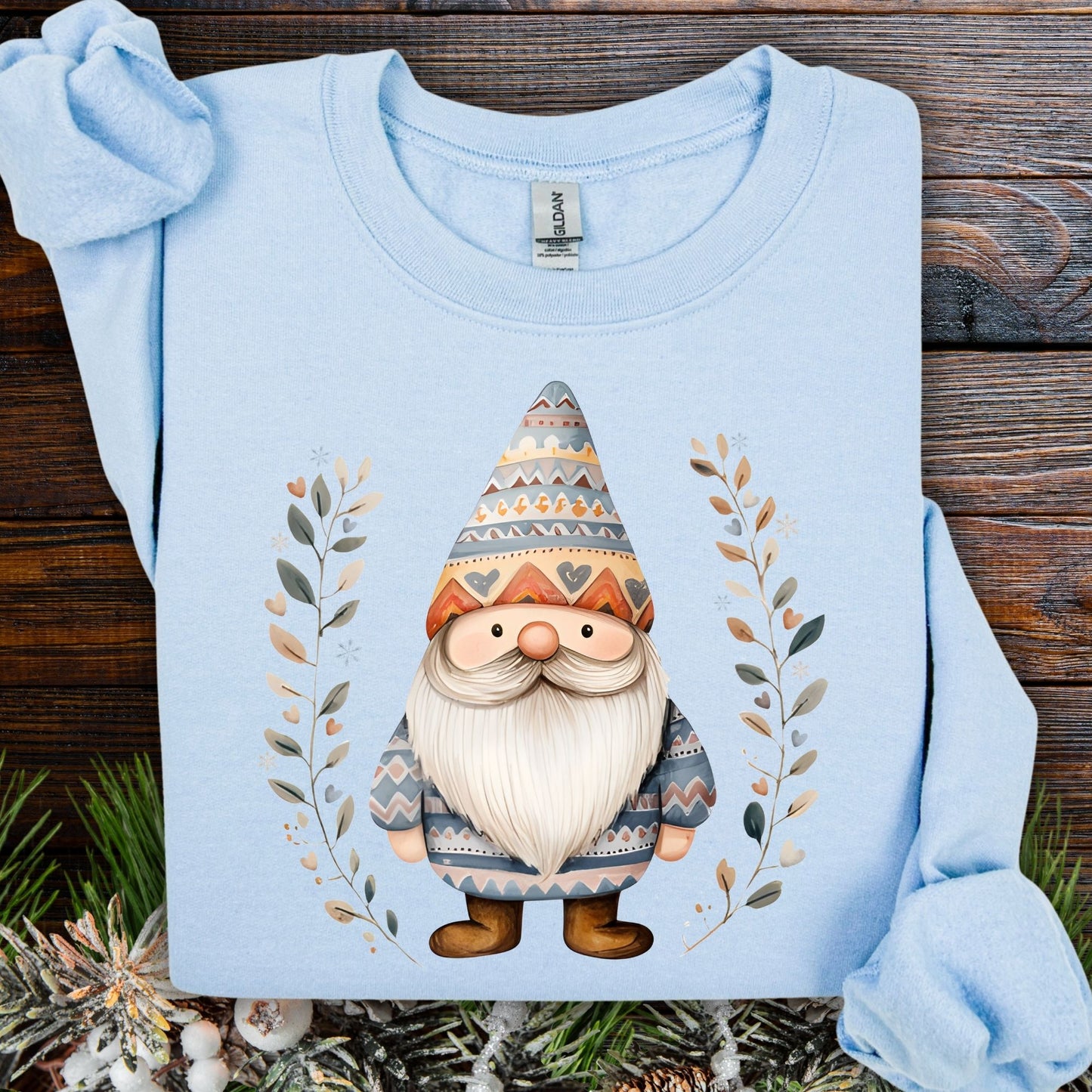 Light blue cotton-poly sweatshirt with a Fair Isle gnome and botanical branches.