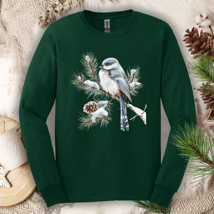 Forest Green long sleeve tee with watercolor long-tailed tit on snowy evergreen branch.