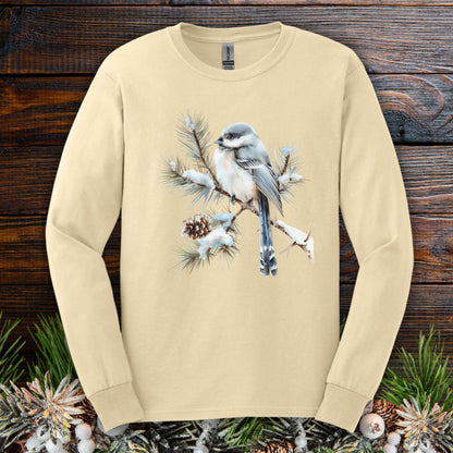 Sand long-sleeve tee with watercolor long-tailed tit on snowy evergreen branch.