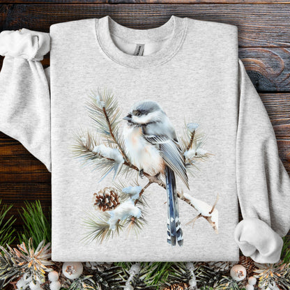 Light gray Gildan 18000 sweatshirt with a watercolor long-tailed tit on a snowy evergreen branch.