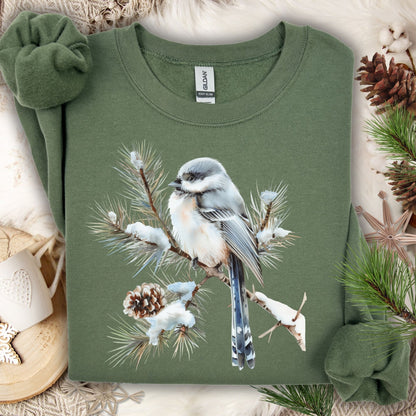 Military Green Gildan 18000 sweatshirt, size S, with a watercolor long-tailed tit on a snowy evergreen bough.