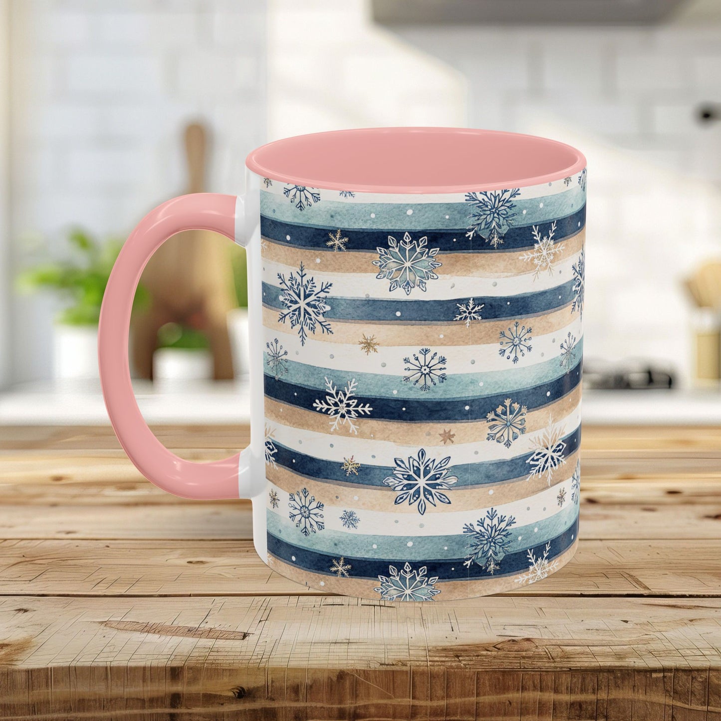 11oz ceramic mug with blue, beige watercolor stripes, delicate snowflakes, and a pink interior and handle.