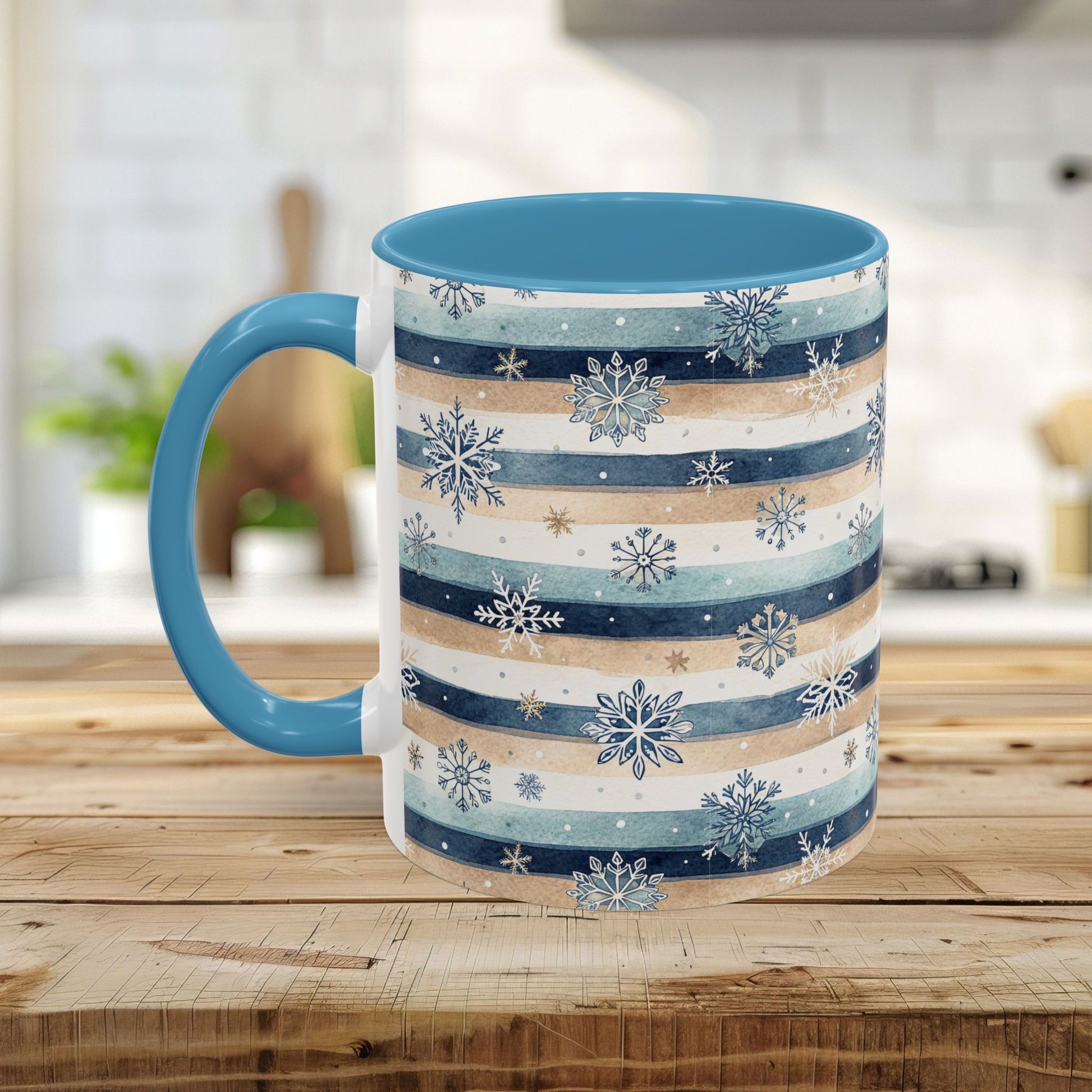 Ceramic mug with blue interior/handle, featuring watercolor blue, beige, and white stripes with snowflakes.