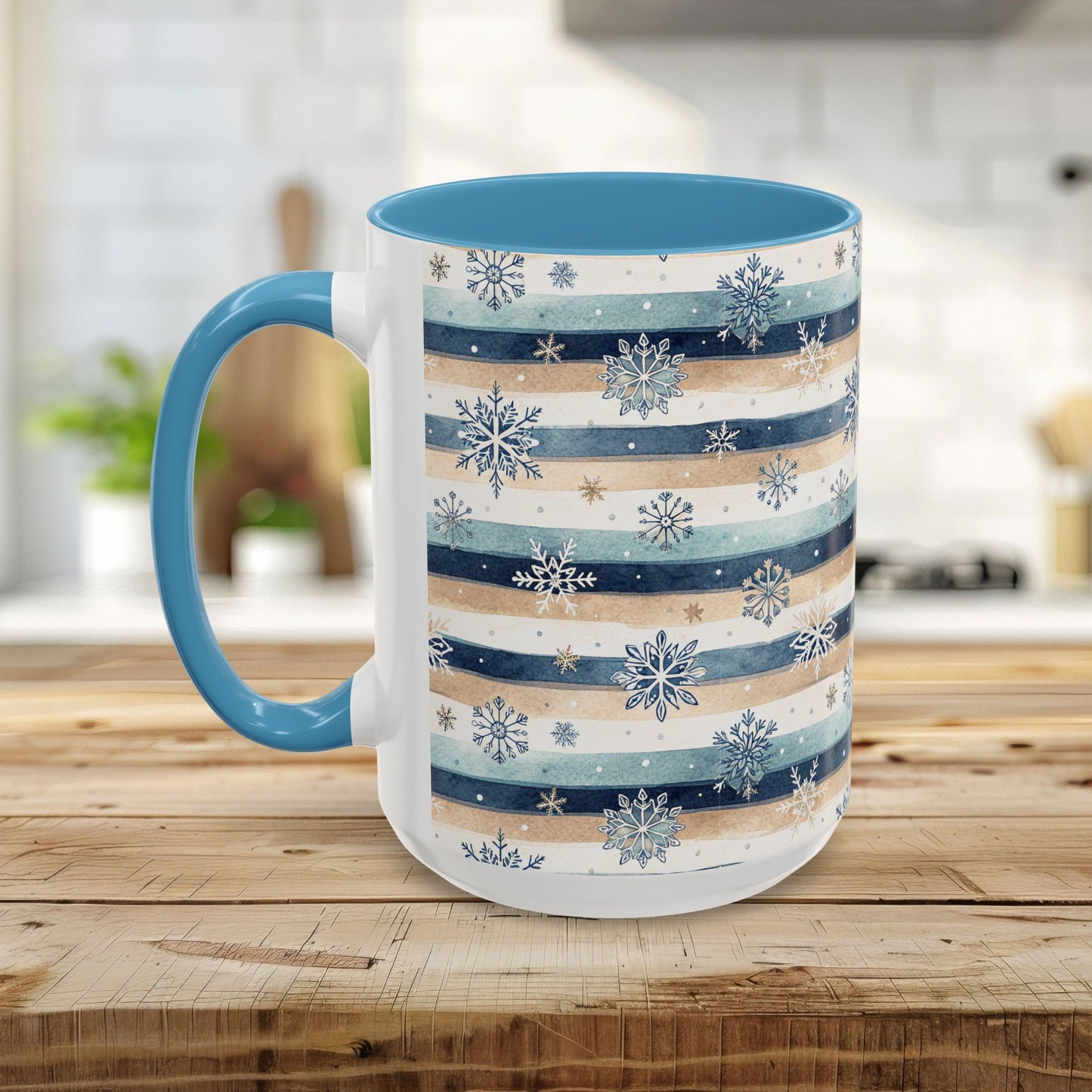 15oz ceramic mug with watercolor blue and beige stripes, hand-painted snowflakes, and a light blue interior and handle.