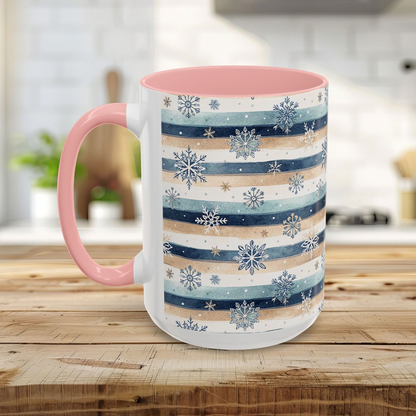 15oz ceramic mug with blue, beige, and white watercolor stripes, snowflake design, pink interior, and handle.