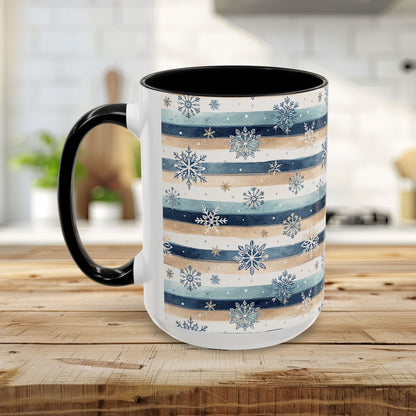 15oz ceramic mug with blue, sandy beige watercolor stripes, snowflakes, and a black interior/handle.
