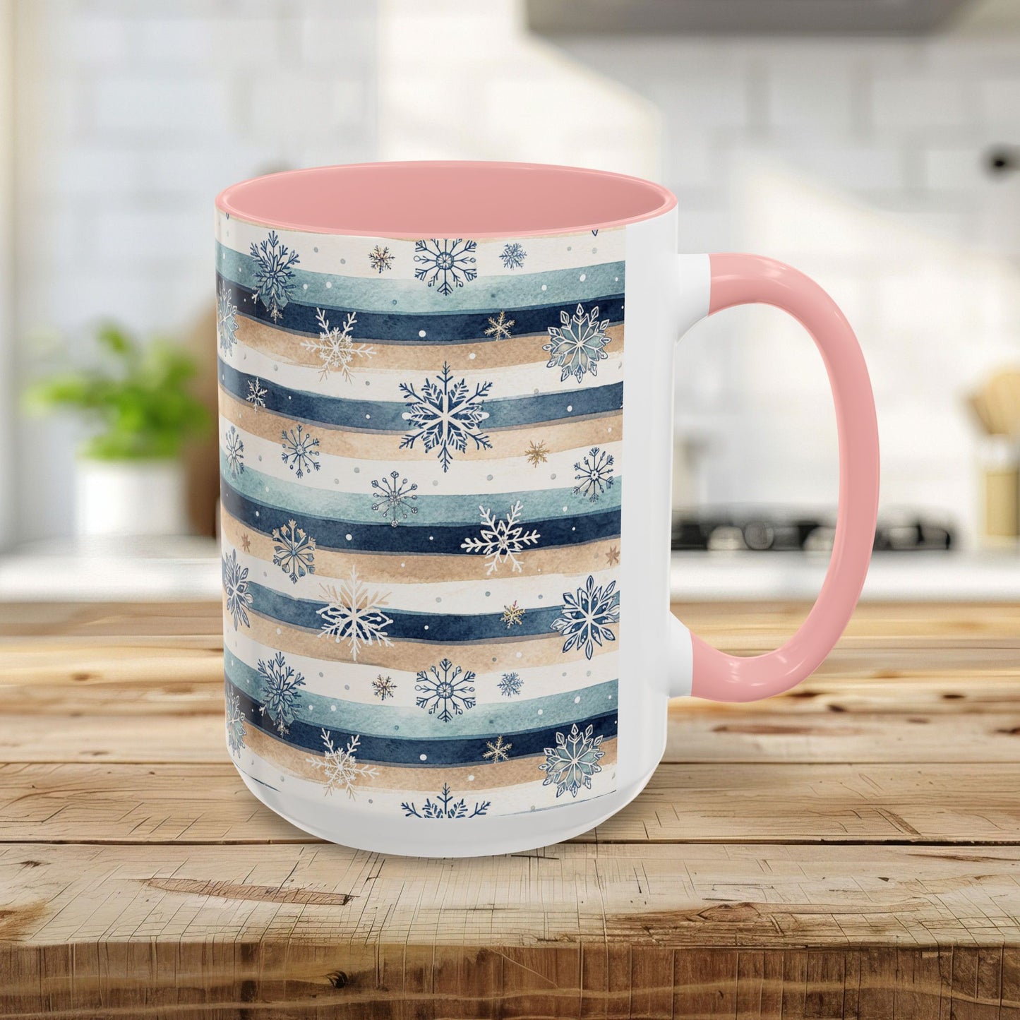 White ceramic 15oz mug with watercolor blue, beige, and white stripes, delicate snowflakes, and a pink interior and handle.