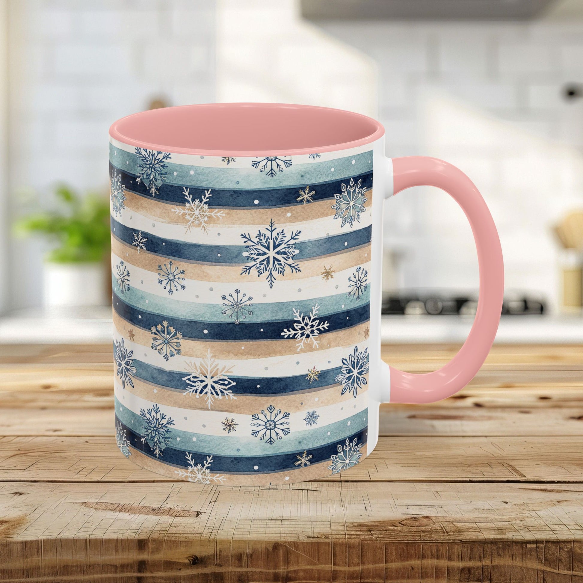 Ceramic mug with blue, beige watercolor stripes and snowflakes, pink interior and handle.
