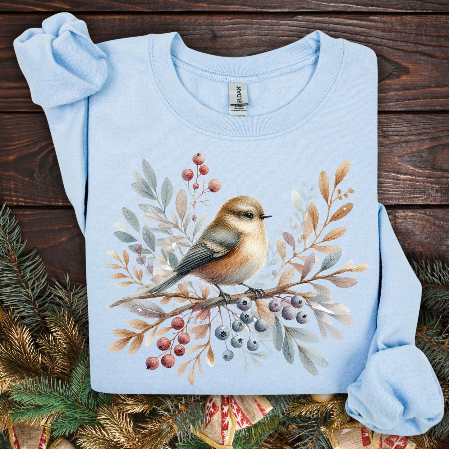 Light blue Gildan crewneck sweatshirt with a watercolor winter sparrow, berries, and foliage design.