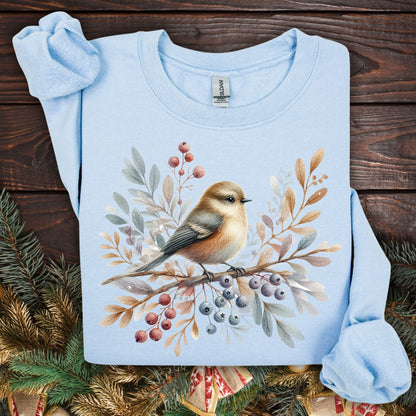 Light blue Gildan crewneck sweatshirt with a watercolor winter sparrow, berries, and foliage design.
