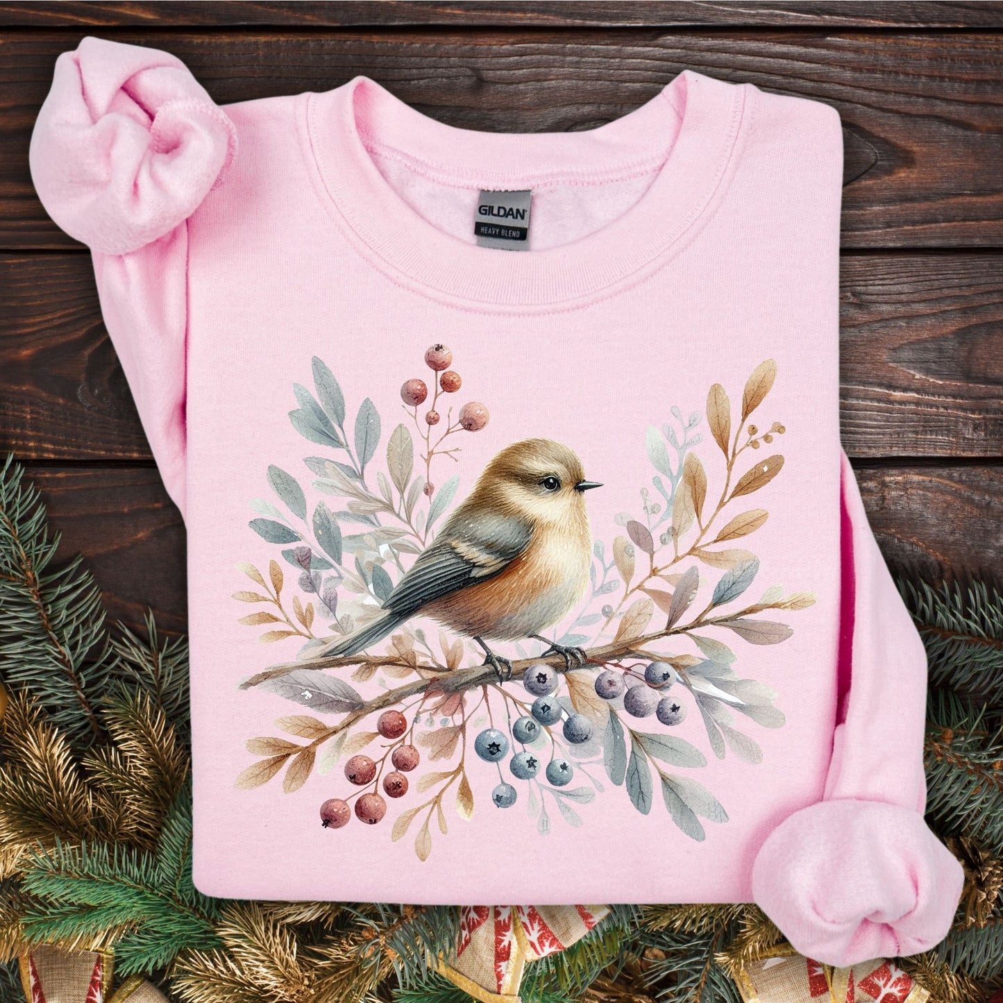 Light pink Gildan crewneck sweatshirt with a watercolor winter sparrow on a branch with berries and foliage.