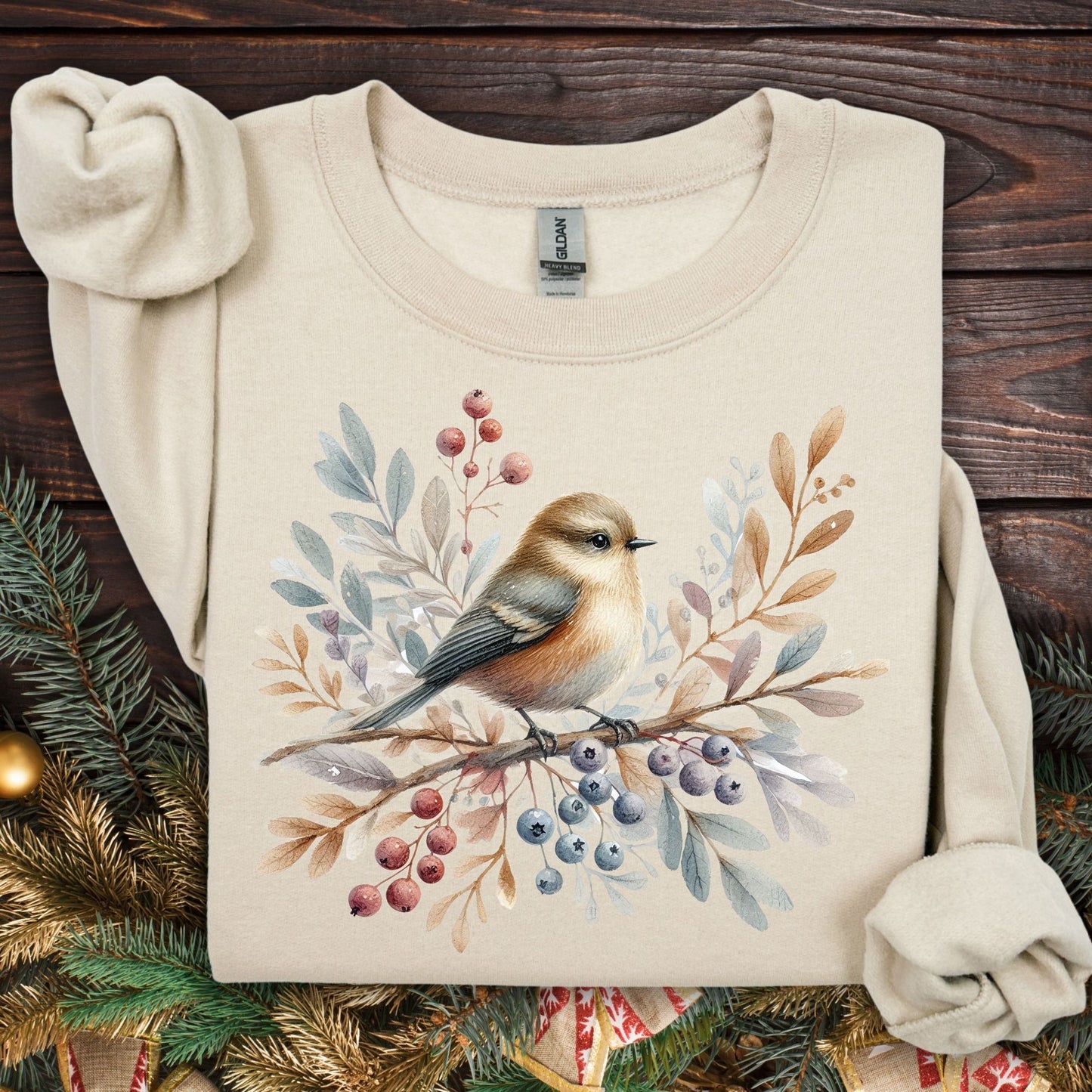 Sand Gildan crewneck sweatshirt with a watercolor winter sparrow, berries, and foliage design.