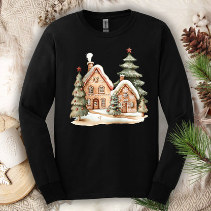 Black Gildan long sleeve tee with a watercolor gingerbread house and evergreen tree design.