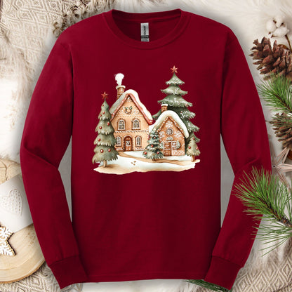 Cardinal Red long sleeve tee with watercolor gingerbread houses, evergreens, and snow.