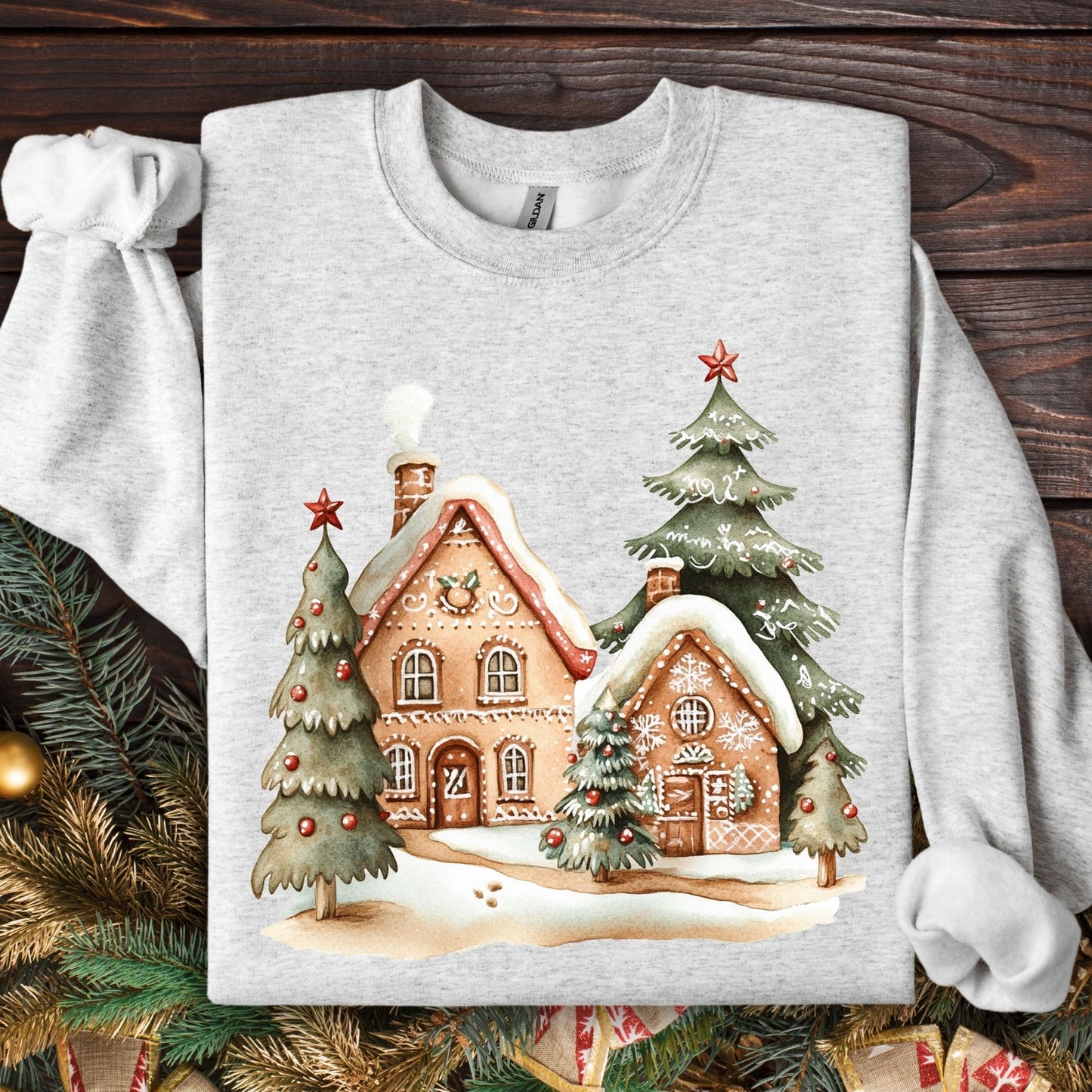 Ash Gildan 18000 sweatshirt with two gingerbread houses and Christmas trees design.