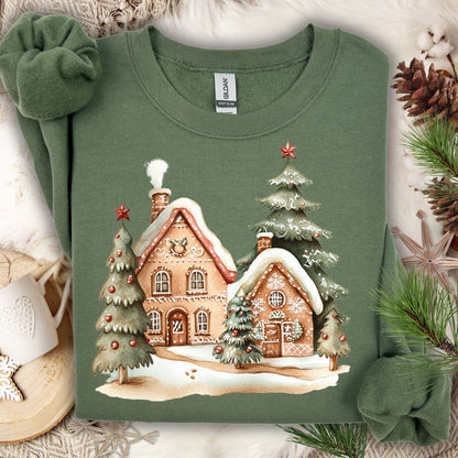 Military Green Gildan 18000 sweatshirt with a gingerbread village and Christmas trees design.