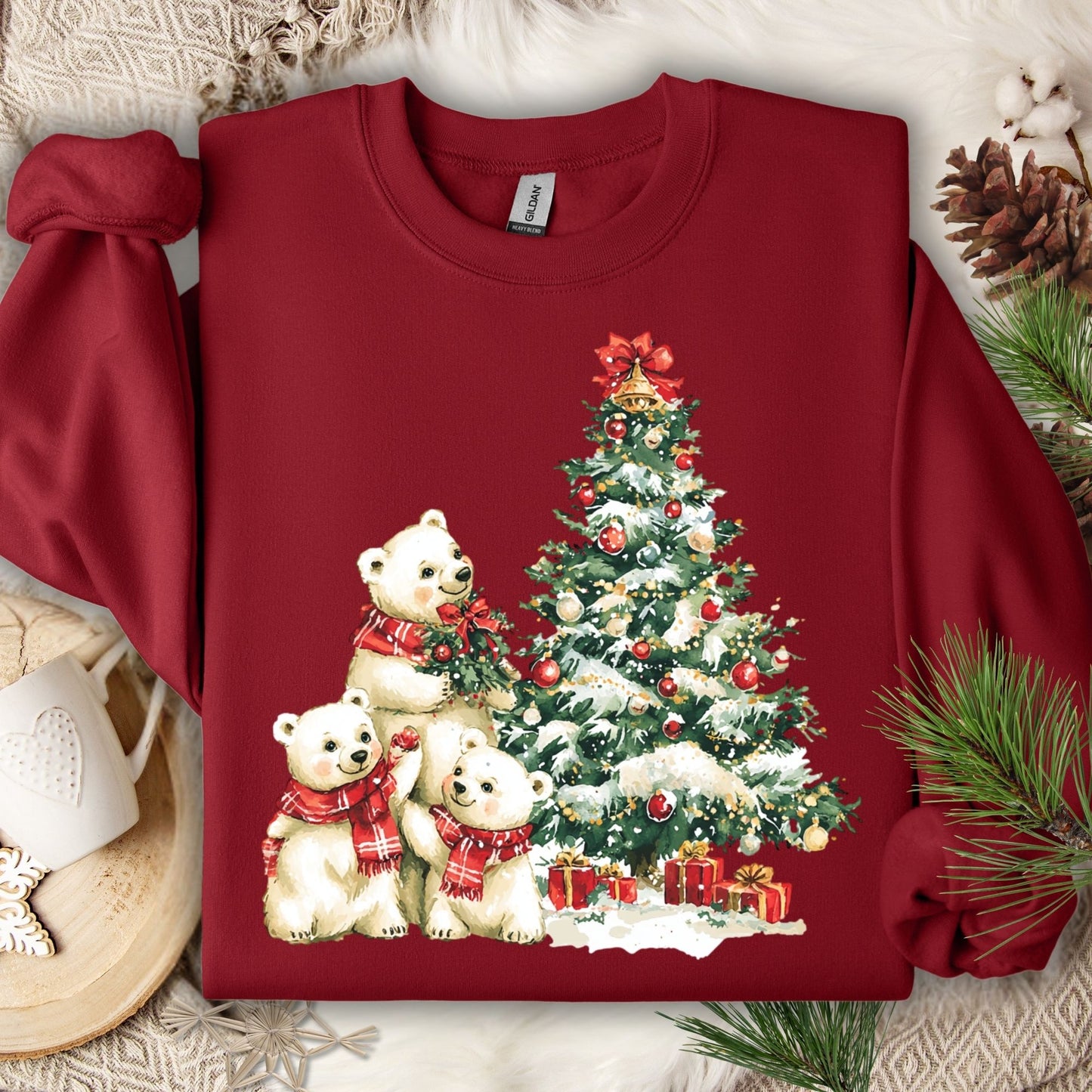 Cardinal Red Gildan 18000 sweatshirt with watercolor polar bears trimming a snowy Christmas tree.