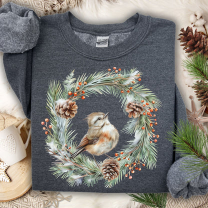 Dark Heather sweatshirt with watercolor wren in evergreen wreath, pinecones, and berries.