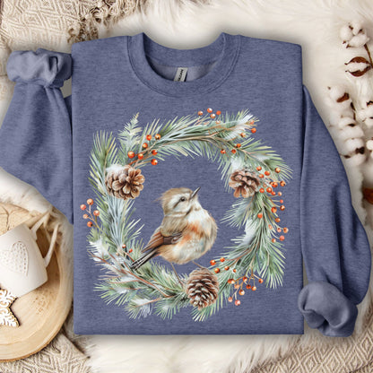 Heather Sport Dark Navy sweatshirt with watercolor wren in evergreen wreath, pinecones, and berries.