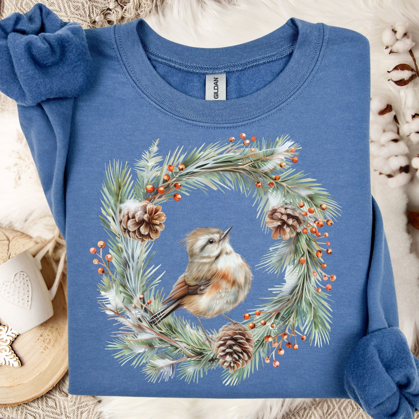 Indigo Blue sweatshirt with watercolor wren in evergreen wreath, pinecones, and red berries.