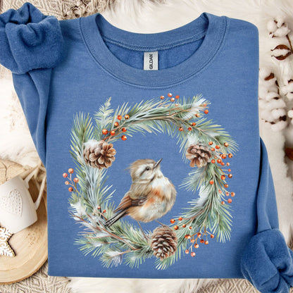 Indigo Blue sweatshirt with watercolor wren in evergreen wreath, pinecones, and red berries.