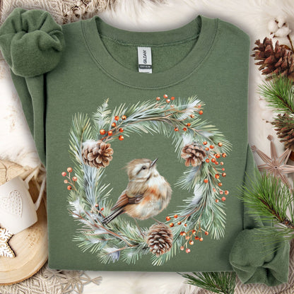 Military Green S sweatshirt with watercolor wren in evergreen wreath, pinecones, and red berries.