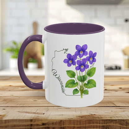 White ceramic mug with purple interior and handle, featuring watercolor wood violets and a Wisconsin outline.