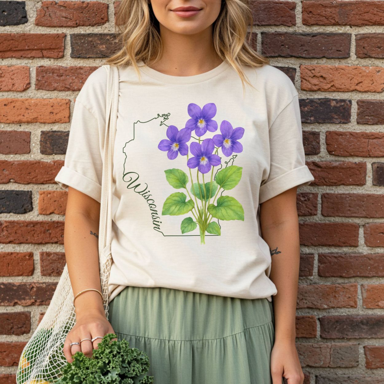 Garment-dyed cream t-shirt with a watercolor wood violet design and Wisconsin state outline.