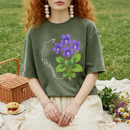 Garment-dyed olive green t-shirt with a watercolor wood violet cluster and Wisconsin state outline.