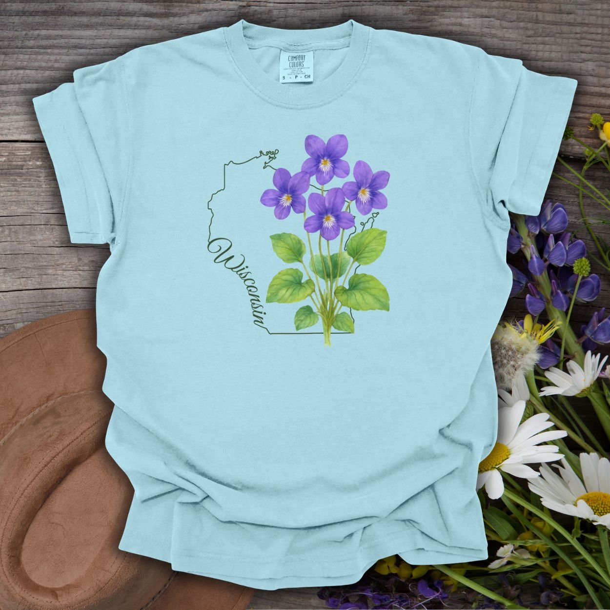 Chambray blue garment-dyed cotton t-shirt with a watercolor wood violet design and Wisconsin outline.