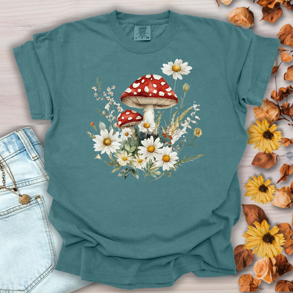 Blue Spruce garment-dyed cotton t-shirt with a vintage floral mushroom and daisy graphic.
