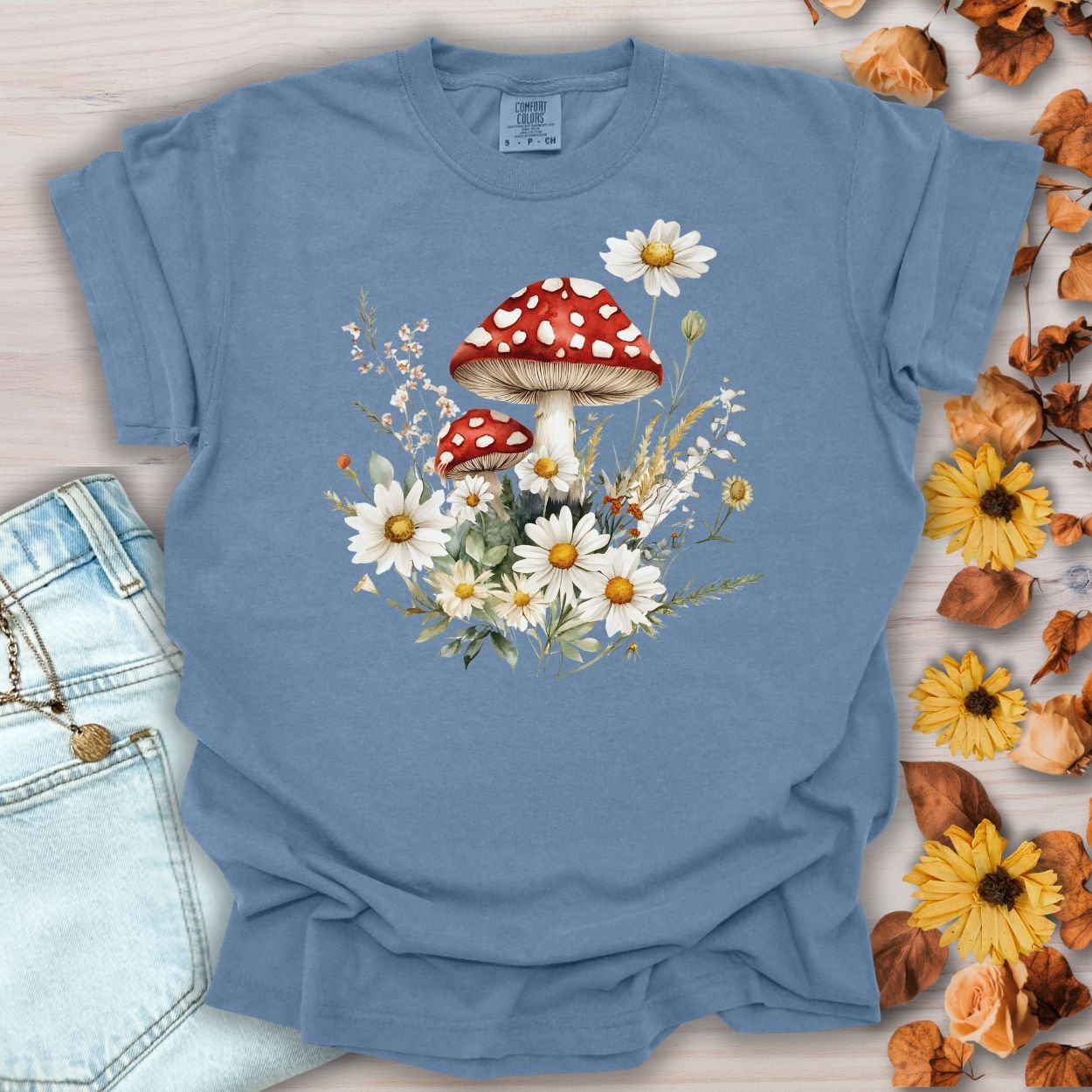 Blue Jean garment-dyed t-shirt with a vintage woodland floral mushroom and daisy illustration.